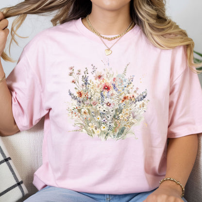 Person wearing a pink t-shirt with a floral design
