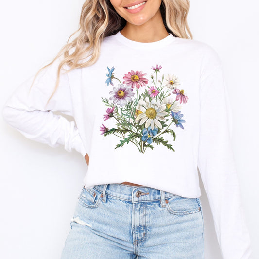 White long sleeve t-shirt with floral design worn by a person on a white background