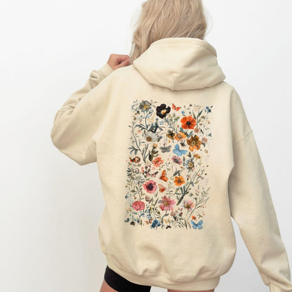 Beige hoodie with floral design on the back against a white background