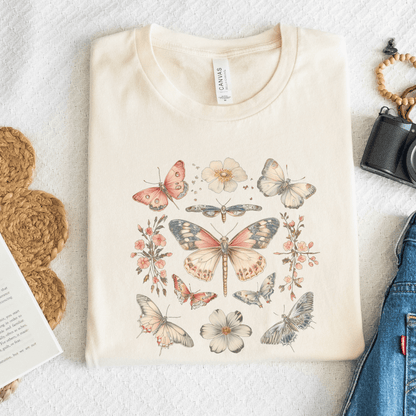 Flat lay of natural t-shirt featuring vintage butterfly and floral design