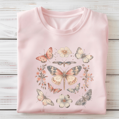 Flat lay of soft pink t-shirt featuring vintage butterfly and floral design