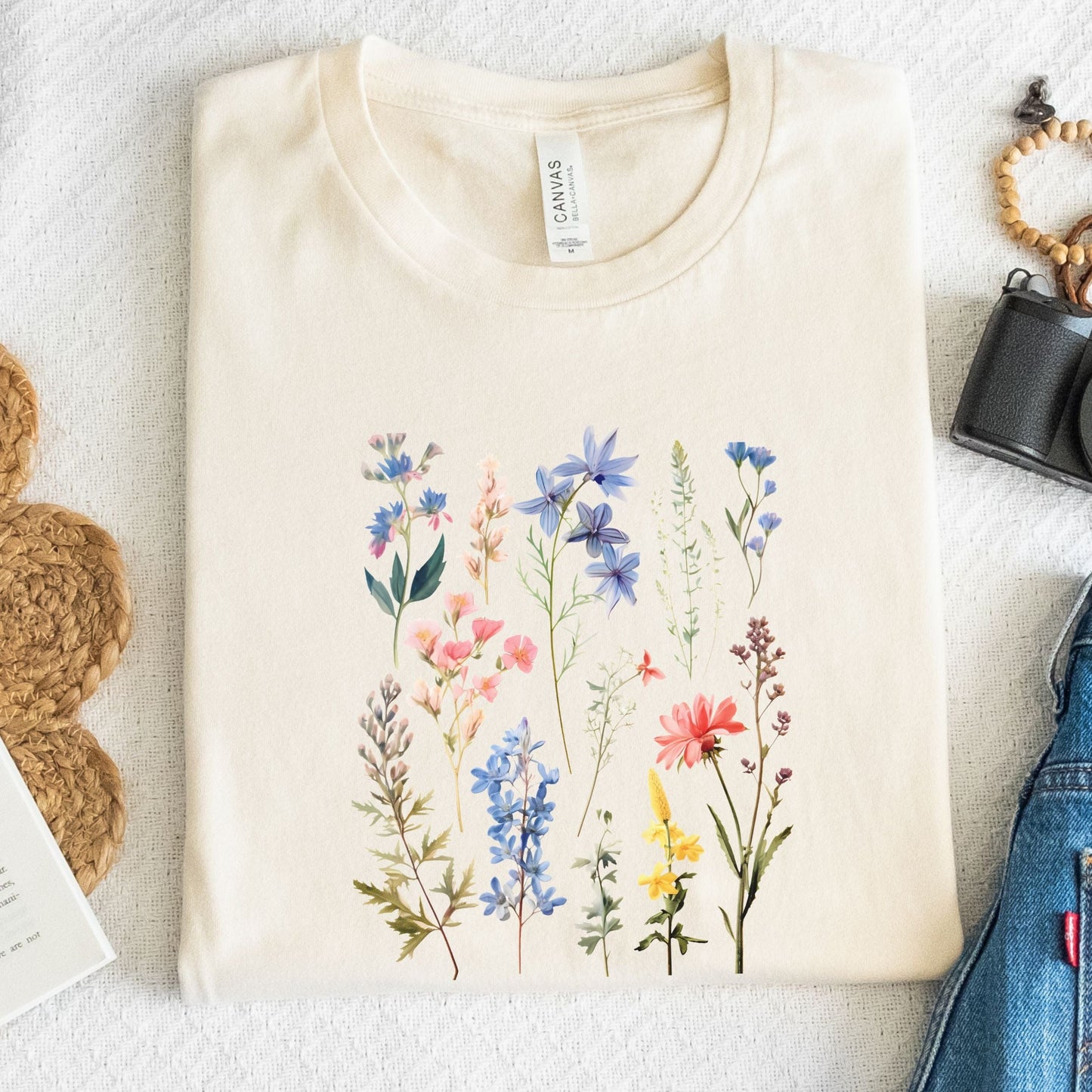 Flat lay of natural t-shirt with vintage wildflower print
