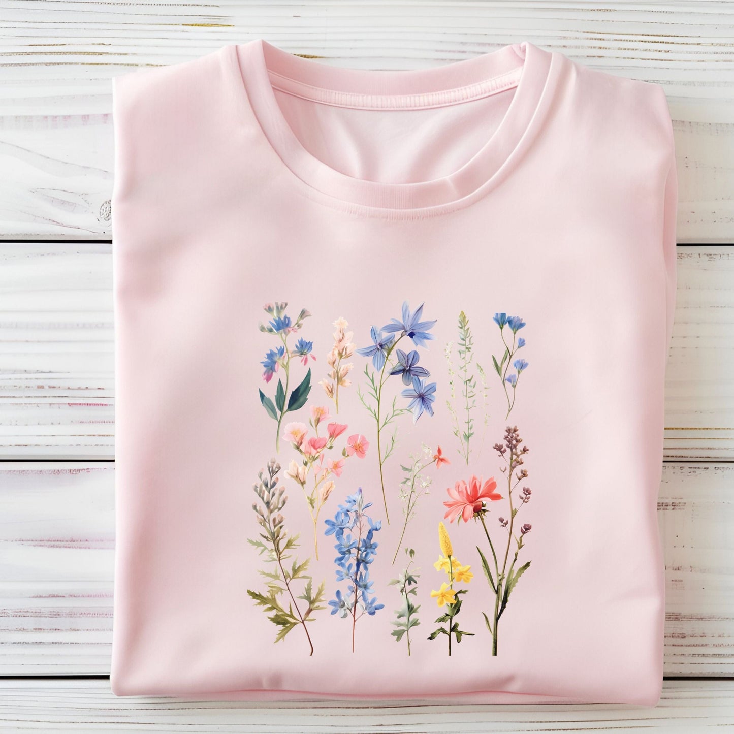 Flat lay of soft pink t-shirt with vintage wildflower print