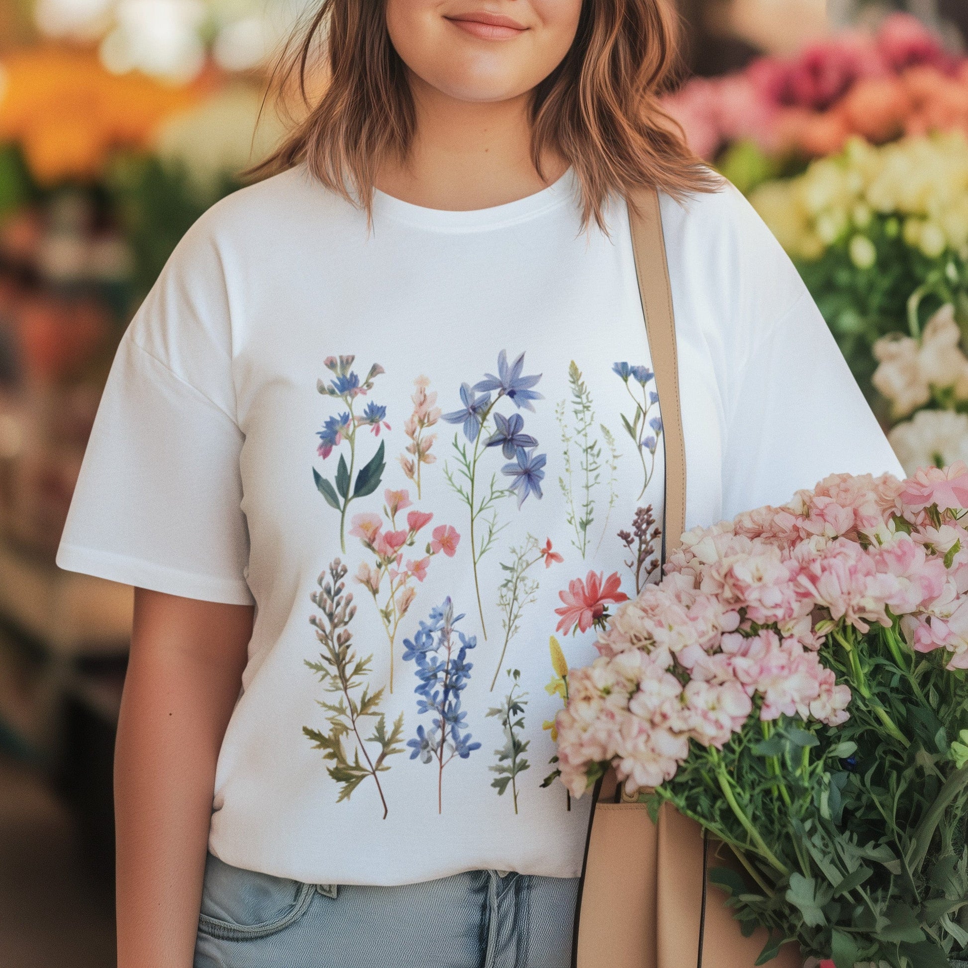 Woman holding flowers wearing vintage wildflower t-shirt