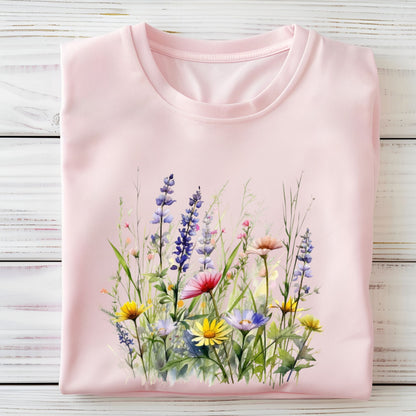 Pink long sleeve t-shirt with a colorful floral design on a wooden surface