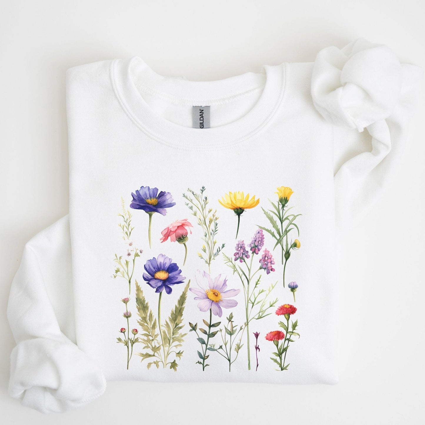 White sweatshirt with colorful floral design on a white background
