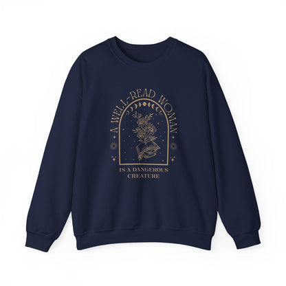 Navy blue sweatshirt with 'A Well-Read Woman is a Dangerous Creature' text on a white background