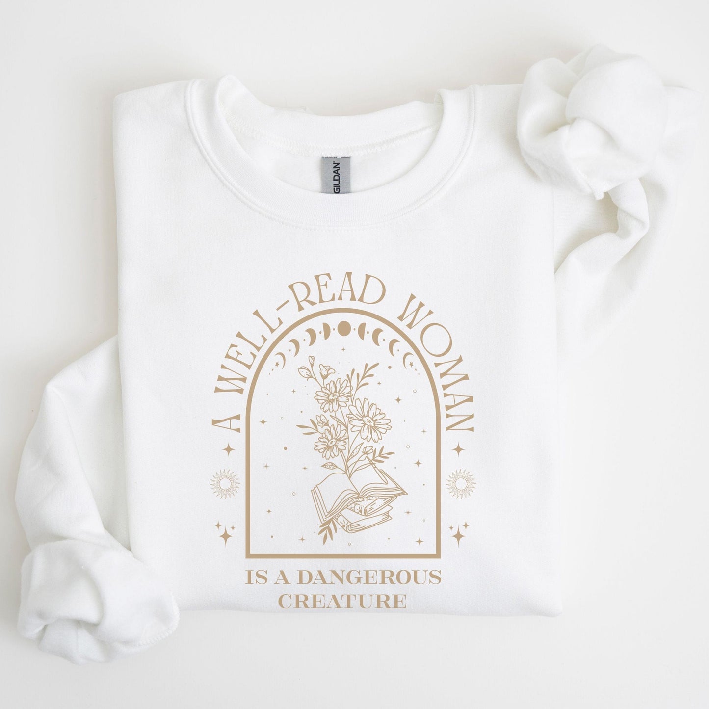 White sweatshirt with gold text and floral design on a white background