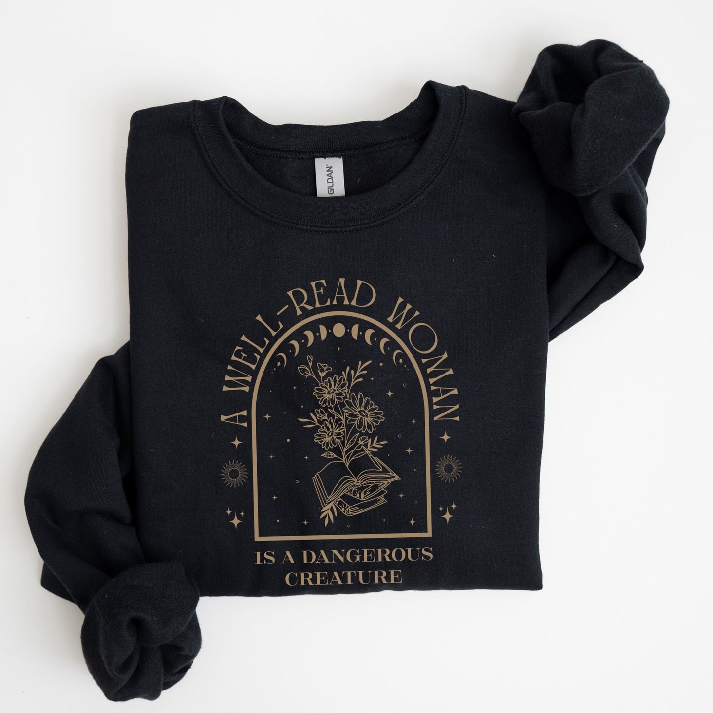 Black sweatshirt with 'A Well-Read Woman is a Dangerous Creature' text and design on a white background
