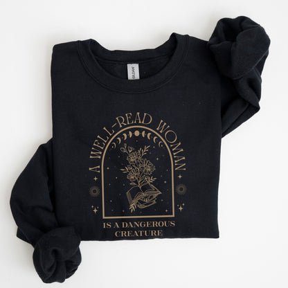 Black sweatshirt with 'A Well-Read Woman is a Dangerous Creature' text and design on a white background