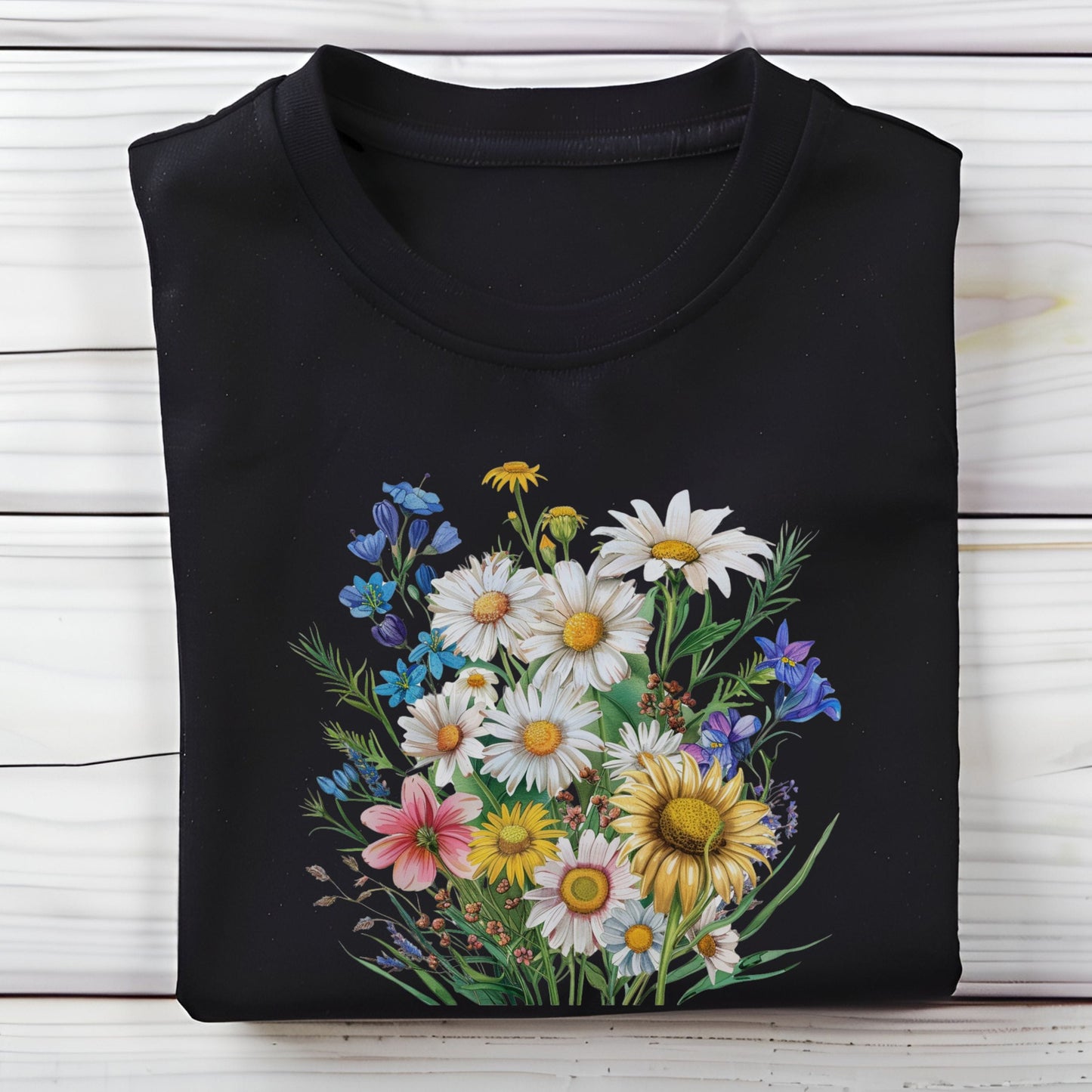 Black long sleeve t-shirt with a colorful floral design on a wooden surface