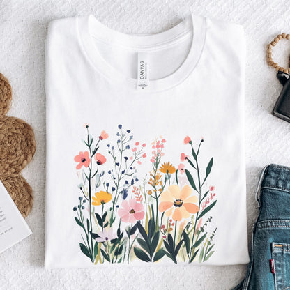 White t-shirt with floral design on a textured surface
