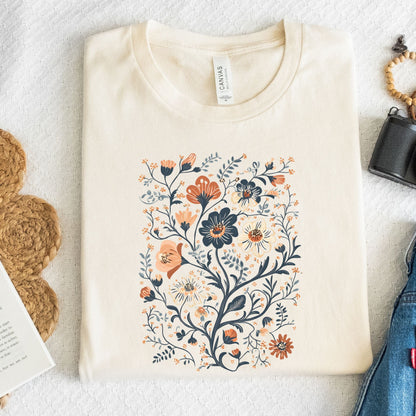 Beige t-shirt with floral design on a textured surface