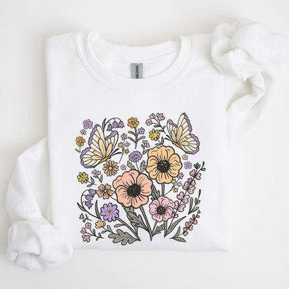 White sweatshirt with floral and butterfly design on a light background