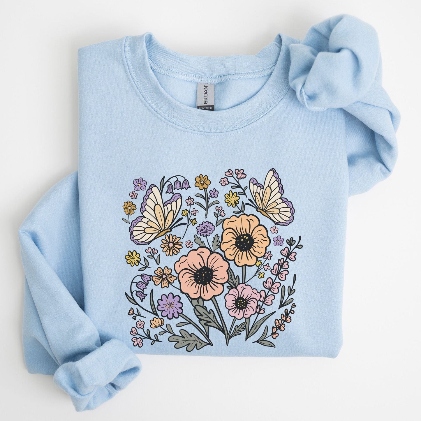 Light blue sweatshirt with floral and butterfly design on a white background