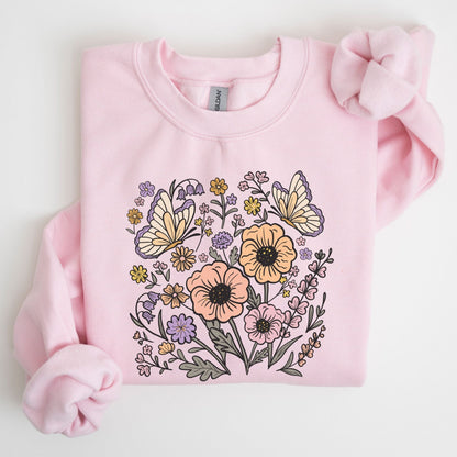 Pink sweatshirt with floral and butterfly design on a white background