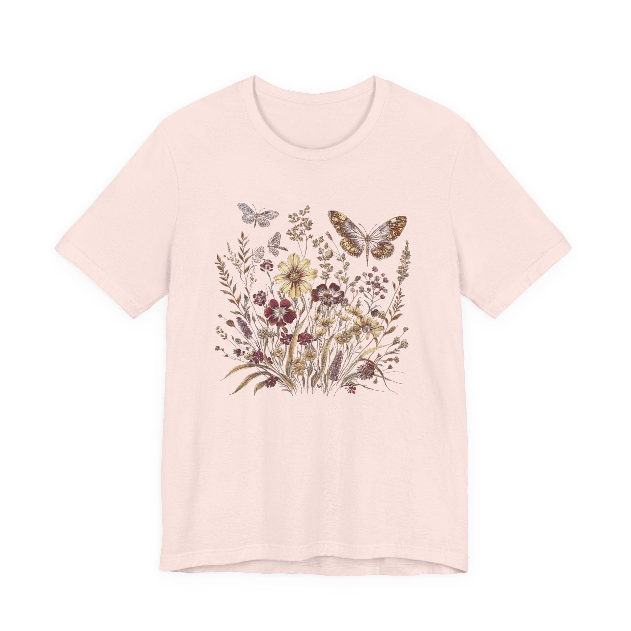 Soft pink t-shirt with floral and butterfly design on a white background