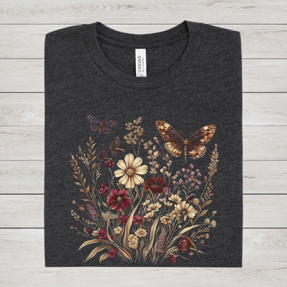 Dark grey heather t-shirt with butterfly and floral design on a textured surface