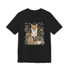Flat lay of black t-shirt featuring woodland fox surrounded by flowers