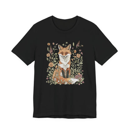 Flat lay of black t-shirt featuring woodland fox surrounded by flowers